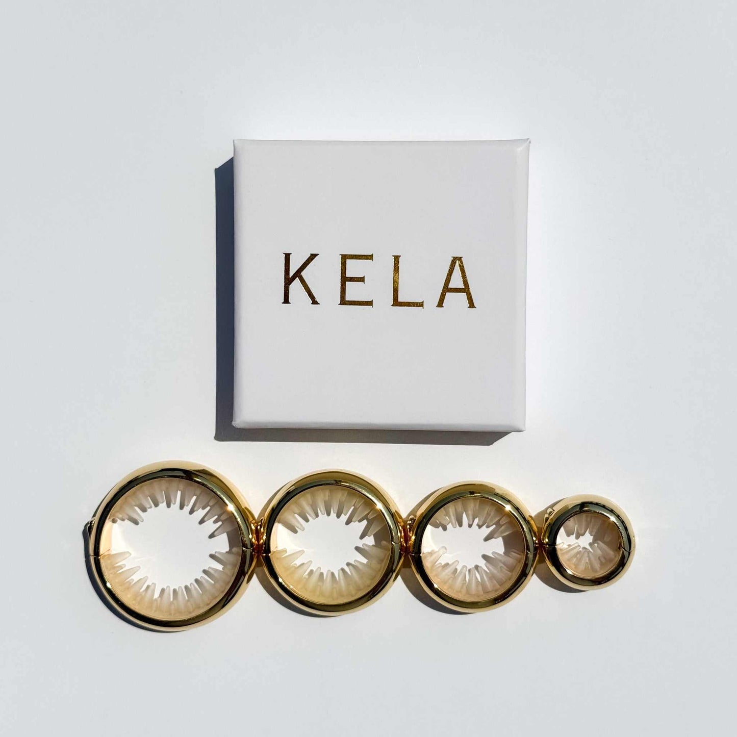 All sizes of KELA Metallic Ponytail Halo hair tie replacements in Shiny Gold with Gift Box