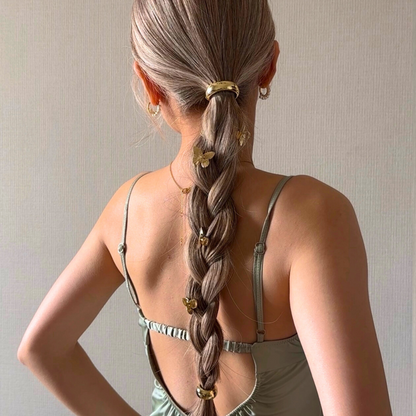 Halo Ponytail Variety in gold with multiple sizes worn on braided light brown hair, accented with butterfly charms and gold hair clips