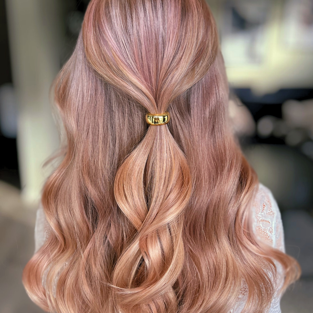 KELA Ponytail Halo Hair Clip Ponytail Holder in gold holding strawberry blonde hair in half up half down ponytail style